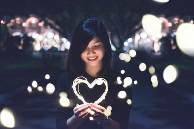 woman holding a heart